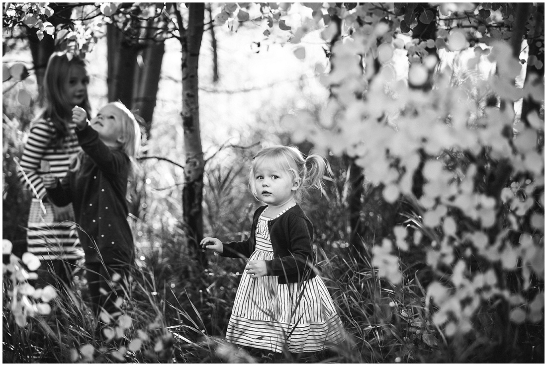 sisters playing in the trees