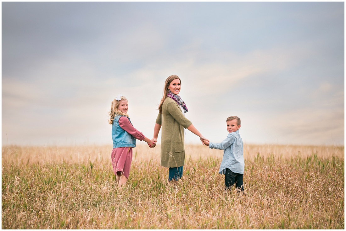 mom and kids in open field